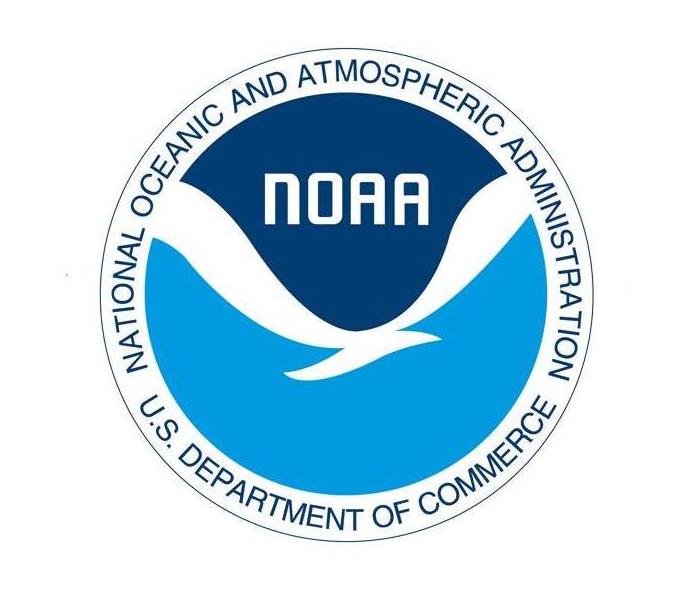 National Oceanic and Atmospheric Administration logo which is a blue and white round circle with a bird in the middle